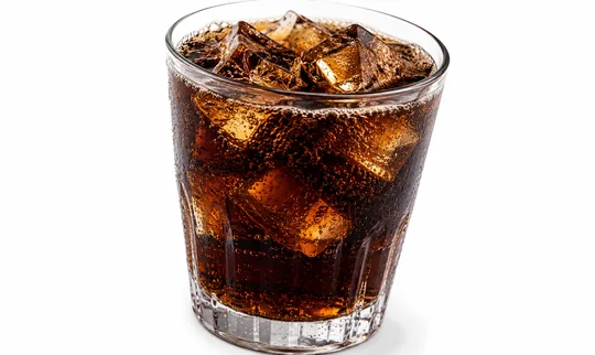 Glass of soda, an acidic drink that weakens enamel around brackets